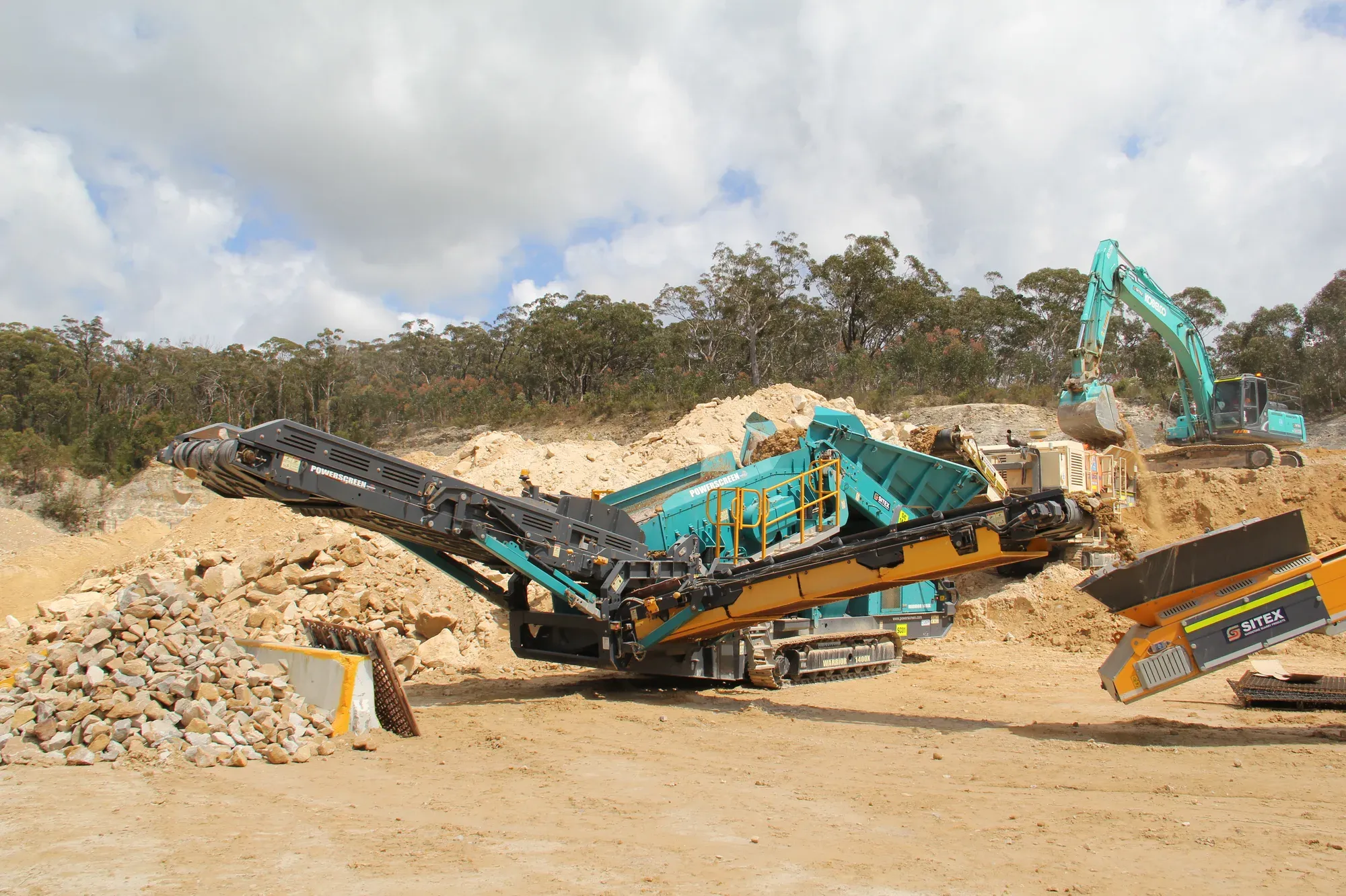 Powerscreen mobile screen working a quarry face